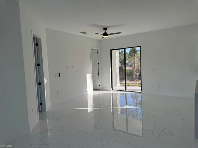 Spare room with ceiling fan