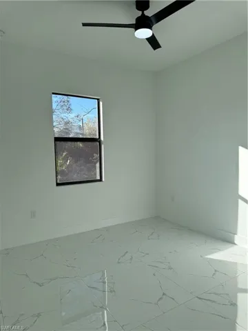 Unfurnished room with ceiling fan