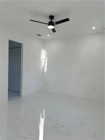 Unfurnished room with ceiling fan