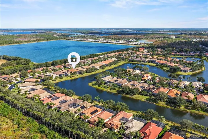 Aerial perspective of suburban area with a large body of water
