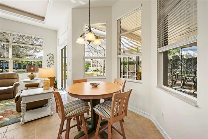 Dining space with a chandelier and light tile patterned floors