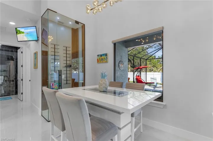 Dining area featuring an inviting chandelier and baseboards