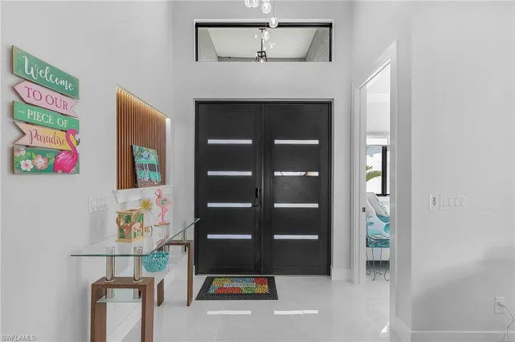 Foyer with french doors and baseboards