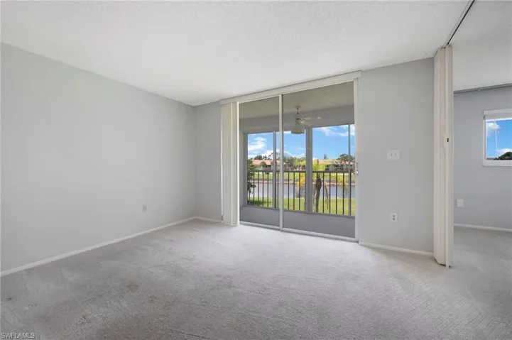 Living Room - View 1 w/ SW Golf Course View