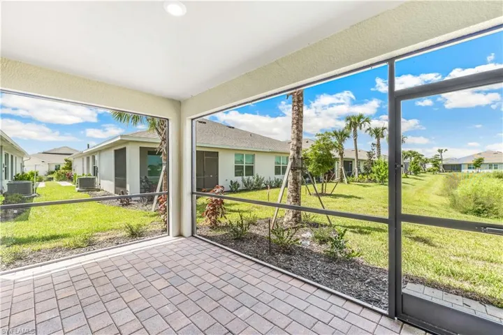 Unfurnished sunroom featuring a residential view and plenty of natural light