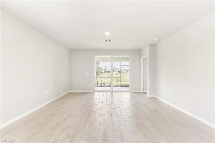 Empty room featuring light wood-style floors and baseboards
