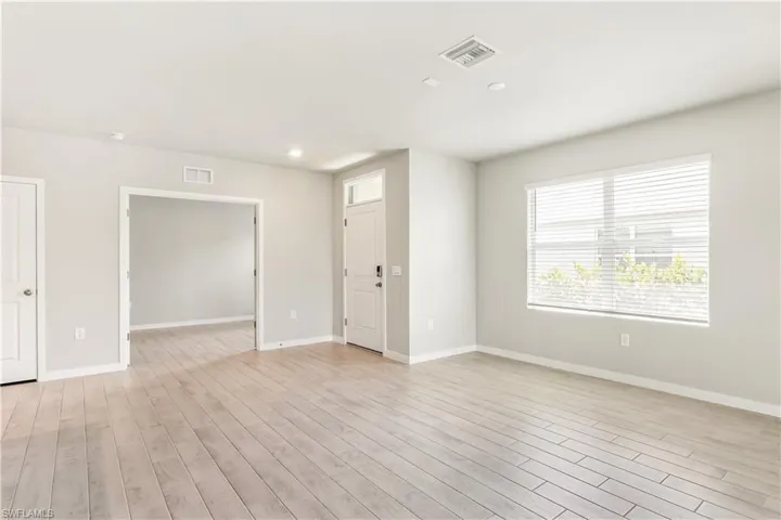 Spare room with recessed lighting and light wood-type flooring