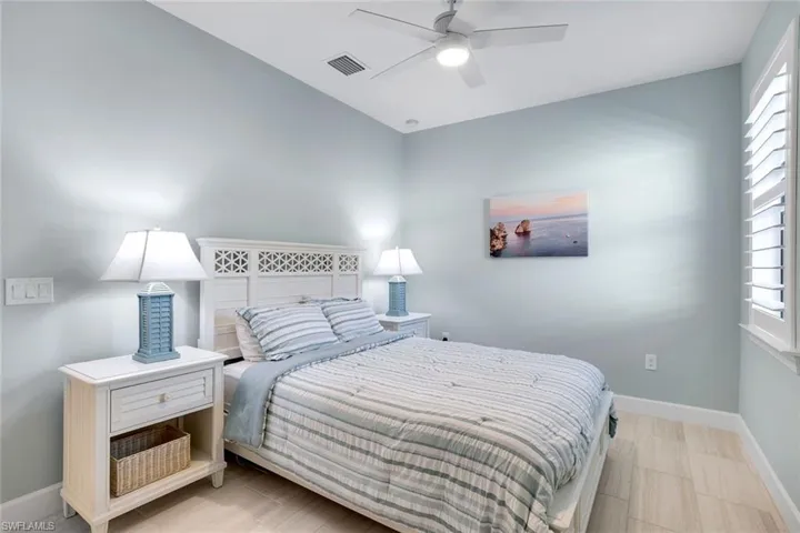 Bedroom with baseboards and ceiling fan