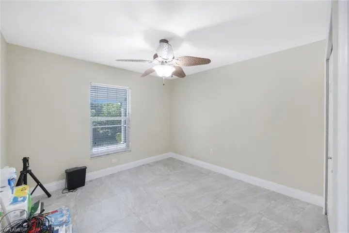 Unfurnished room featuring ceiling fan