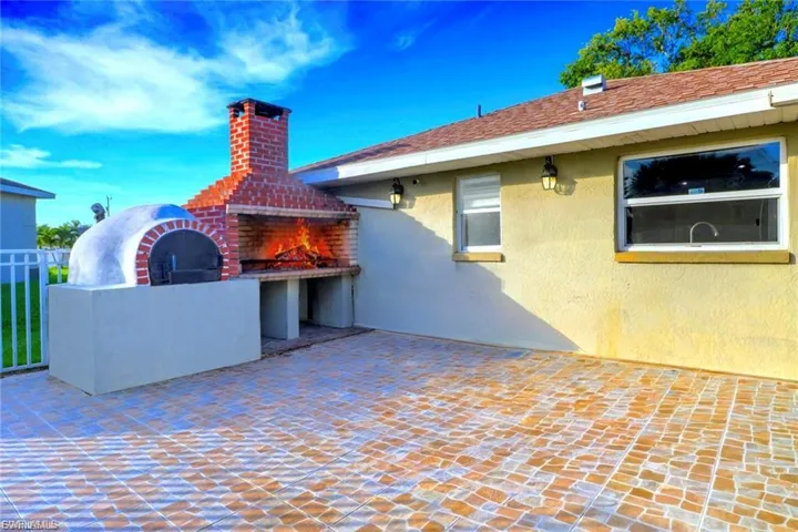 View of patio featuring a fireplace
