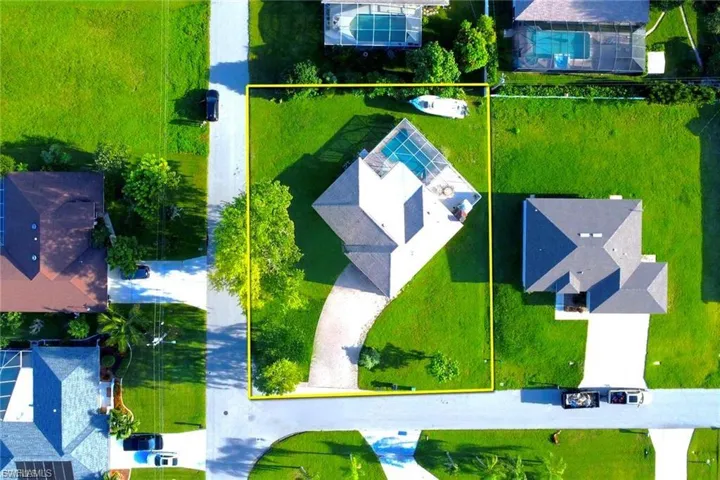 Aerial perspective of suburban area with property parcel outlined