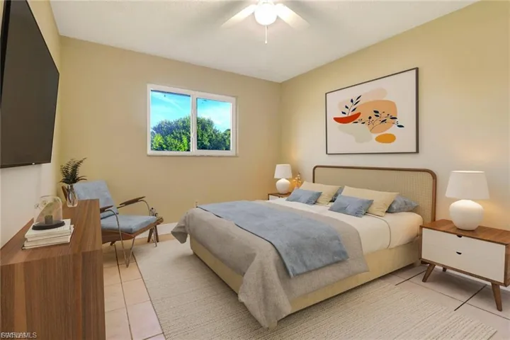 Bedroom featuring a ceiling fan and light tile patterned floors