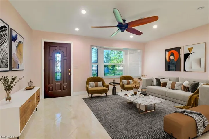 Living area featuring a ceiling fan and recessed lighting