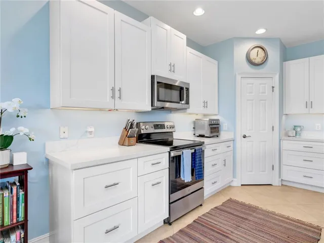 Kitchen with Island, Quartz Counters, & Pantry