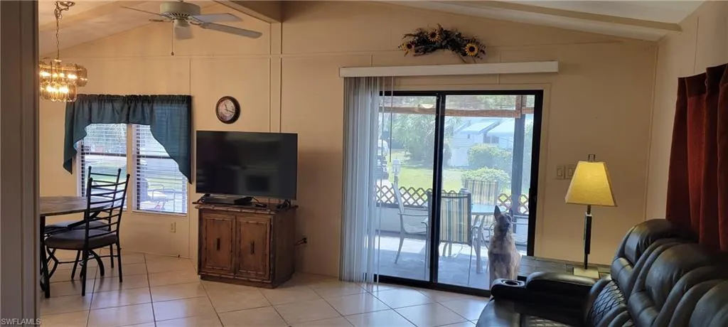 Tiled living room with vaulted ceilings
