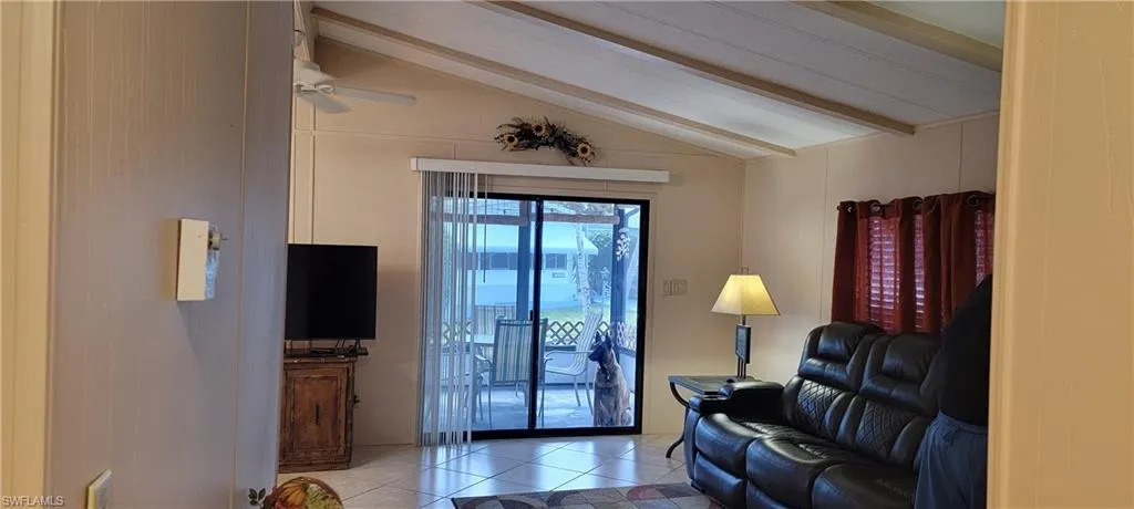 Living room has vaulted ceiling