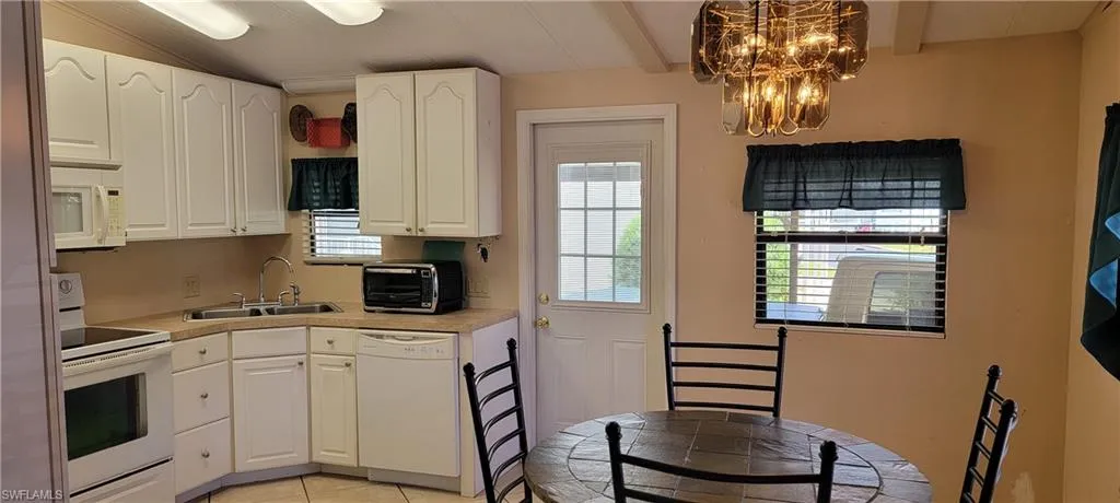 Kitchen, white cabinets, vaulted ceiling