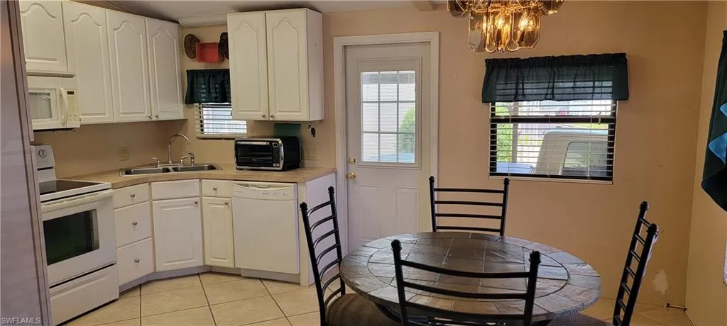 Eat In Kitchen and light tile floors