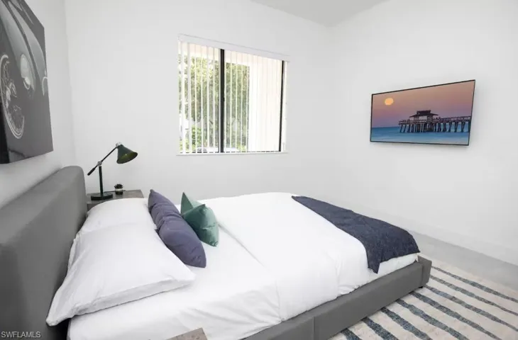 Bedroom with a front yard view