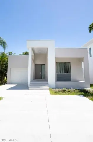 The front yard, garage, space for parking