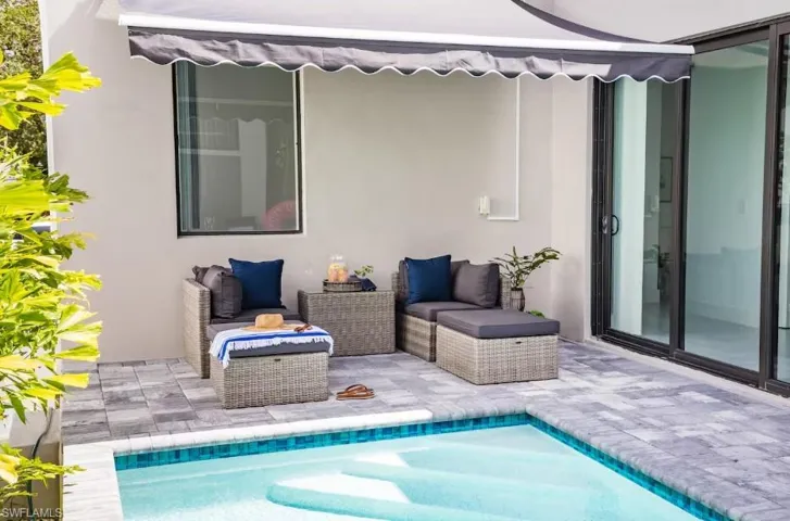 Patio with a swimming pool view