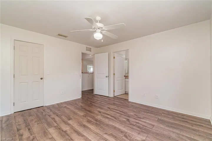 Primary bedroom with walkin closet