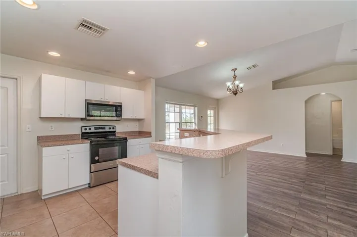 Kitchen with island and breakfast bar