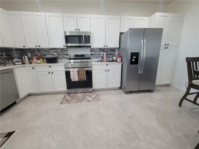 Tiled dining area with sink