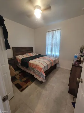 Dining area with light tile patterned floors