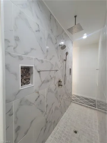 Bathroom with tiled shower