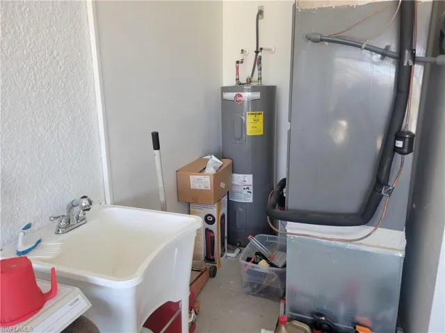 Washroom featuring washer and dryer and light tile patterned floors