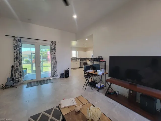 Utilities featuring electric water heater, heating unit, and sink