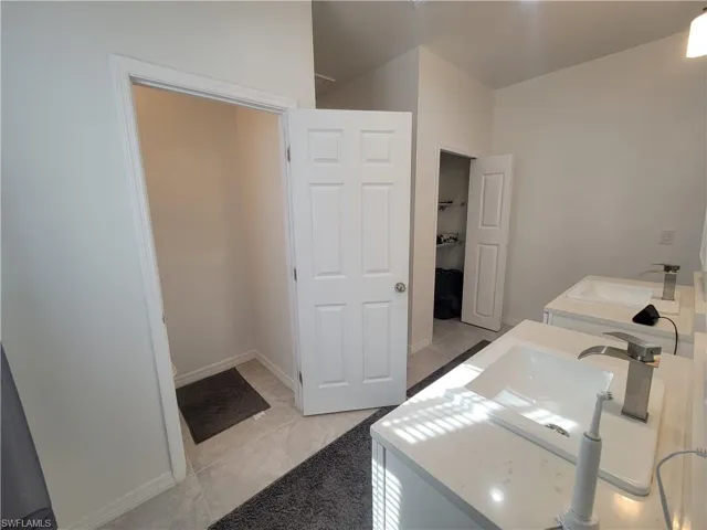 Bathroom with tile patterned flooring and toilet