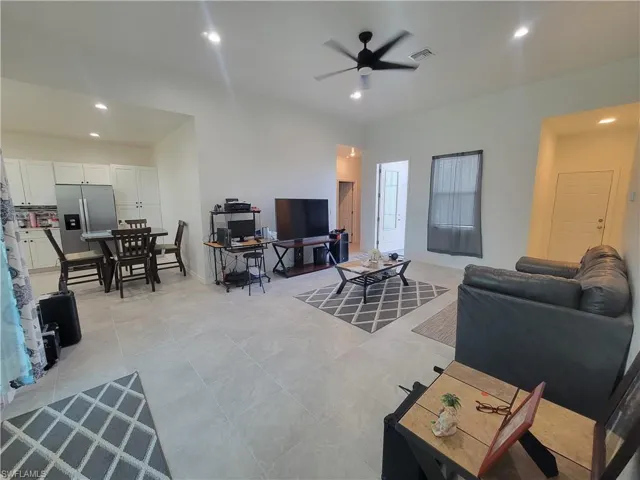 Tiled living room with ceiling fan