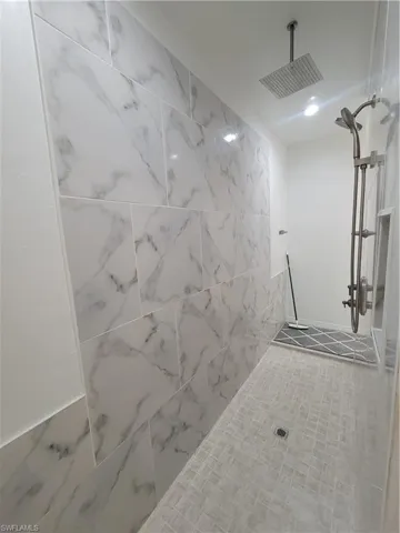 Bathroom with a tile shower