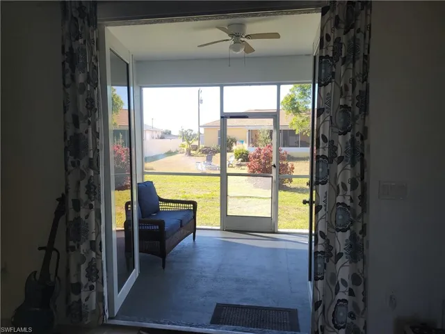 Sunroom / solarium featuring ceiling fan