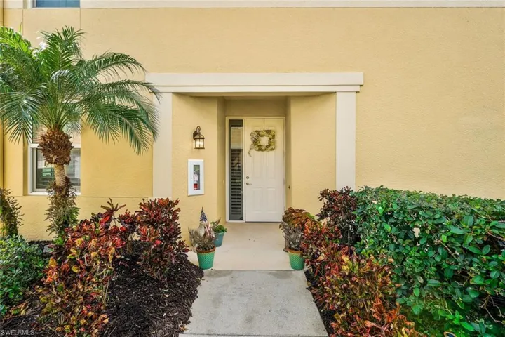 Property entrance with stucco siding