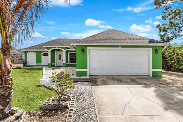 Single story home with stucco siding and roof with shingles