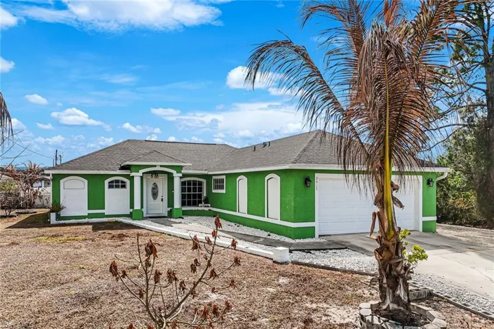 Single story home featuring stucco siding, a shingled roof, concrete driveway, and a garage