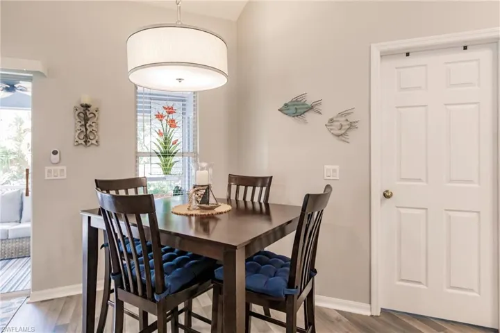 Dining space with wood-type flooring