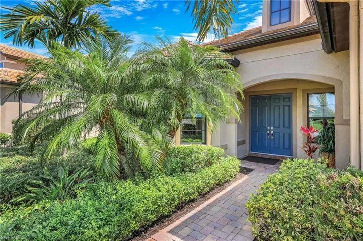 Doorway to property with stucco siding