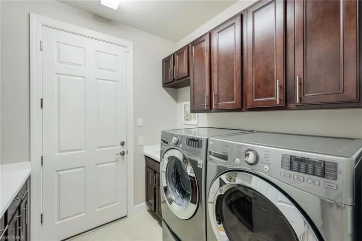 Laundry area with washing machine and dryer and cabinet space