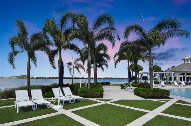 View of property's community featuring a patio area, a water view, a pool, and a gazebo