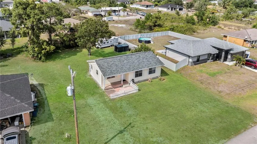 Birds eye view of property with a residential view