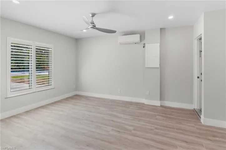 FAMILY ROOM OFF LIVING AREA BY FRENCH DOORS. WAS THE GARAGE. STEPS UP TO LAUNDRY ROOM