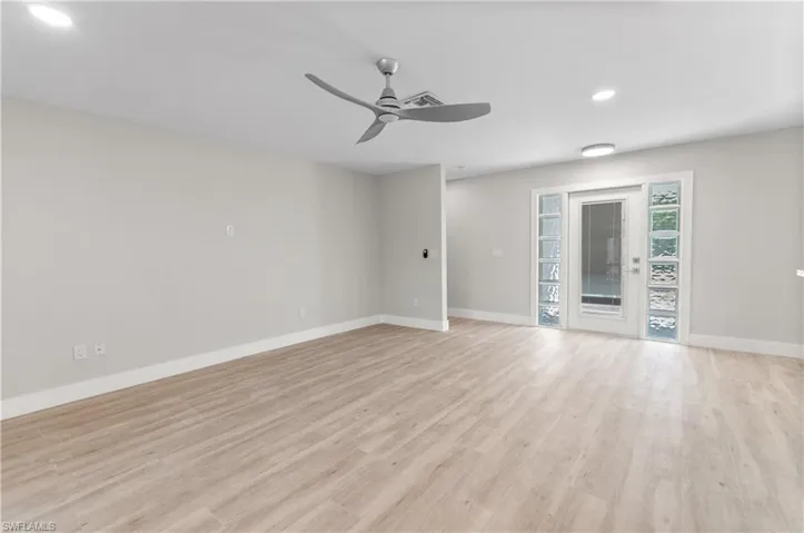 Unfurnished room featuring a ceiling fan, light wood finished floors, and recessed lighting