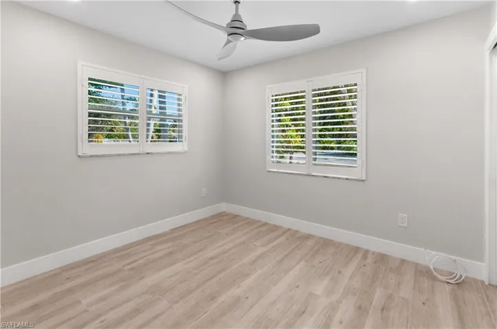 room featuring light wood-type flooring, ceiling fan, and recessed lighting