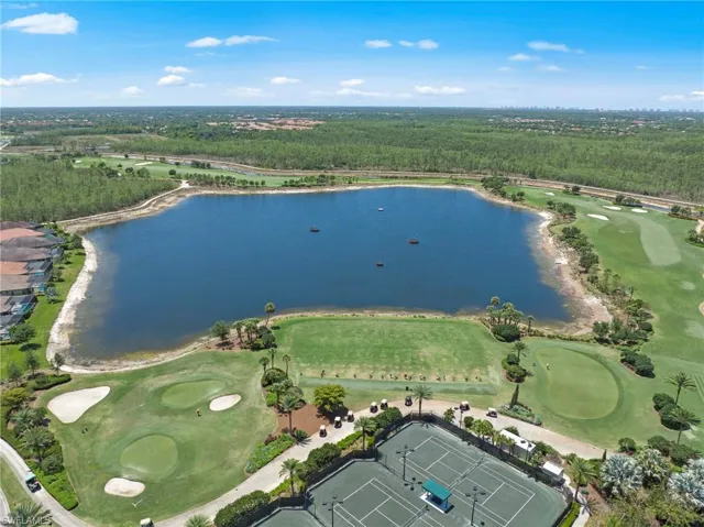 Expansive lake surrounded by manicured golf course greens