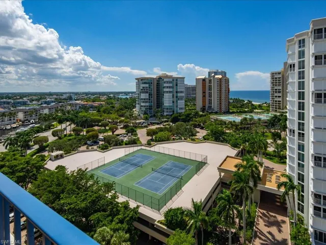Birds eye view of property with a water view