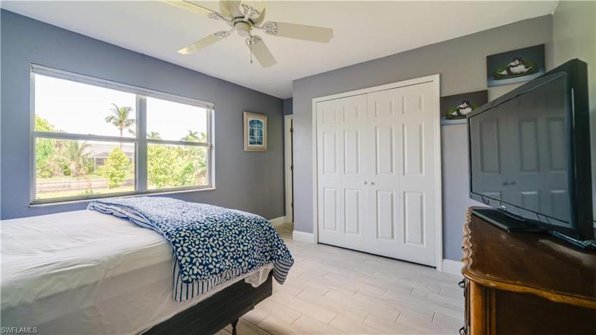Primary bedroom has a large window and closet. Master bath is to the left of the closet.